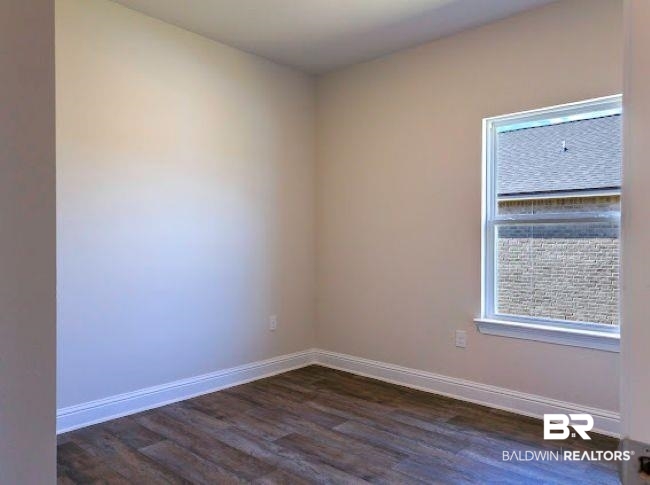 13791 Logan Place Foley, AL 36535 - Photo 19 of 25 Room featuring wood-finish flooring, neutral wall paint, and white baseboards