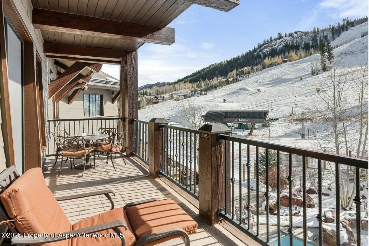 75 Prospector Road, Unit 83034 Aspen, CO 81611 - Photo 18 of 25 a view of a balcony with furniture
