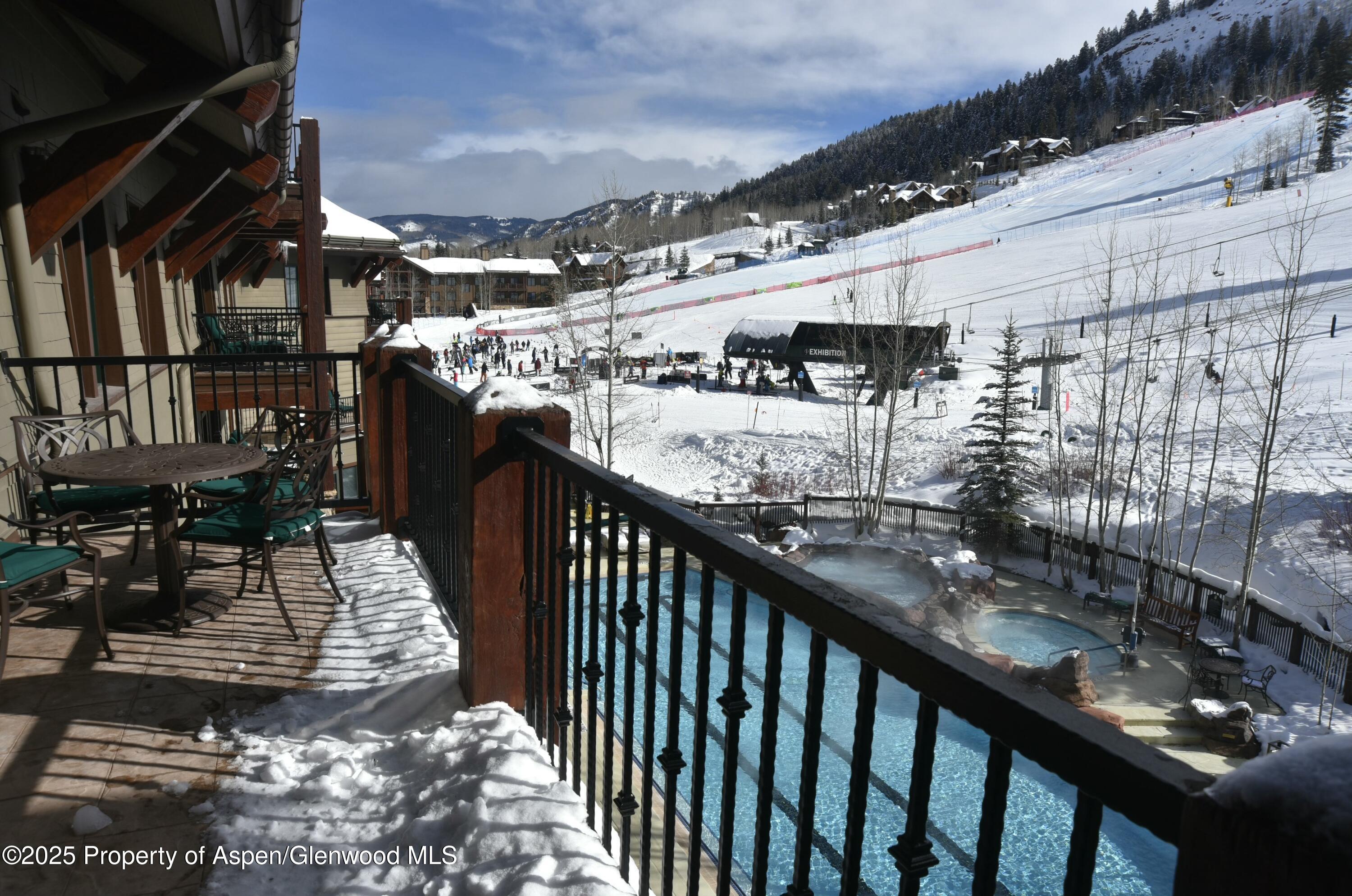75 Prospector Road, Unit 83034 Aspen, CO 81611 - Photo 24 of 25 a view of a balcony with furniture