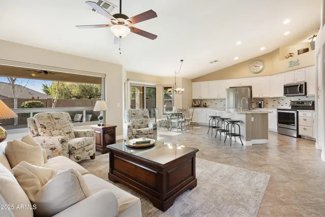 a bathroom with a double vanity sink mirror and shower
