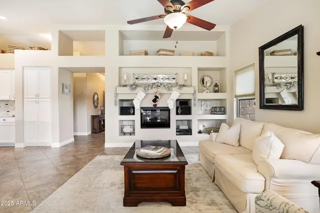 a bathroom with a granite countertop sink a mirror and shower
