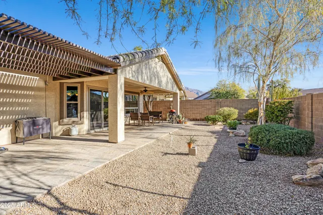 an outdoor space with patio furniture and ocean view