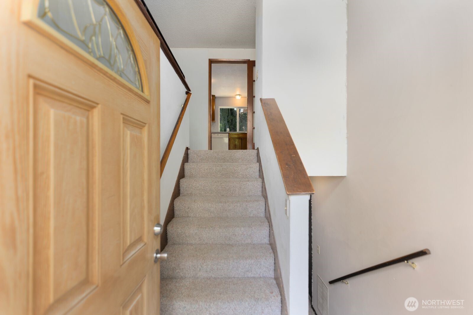 21627 9th Place West Bothell, WA 98021 - Photo 5 of 40 a view of staircase with railing and white walls