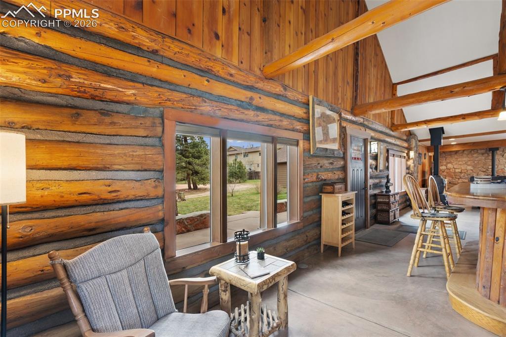1100 Rampart Range Road Woodland Park, CO 80863 - Photo 6 of 50 Rustic log detailing in the inviting entry