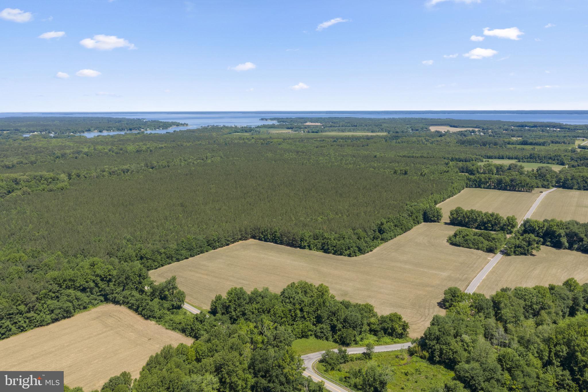 1 Wilton Road Hague, VA 22469 - Photo 3 of 13 a view of a lake from a yard