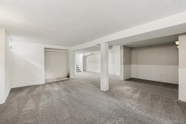 a view of an empty room with stairs