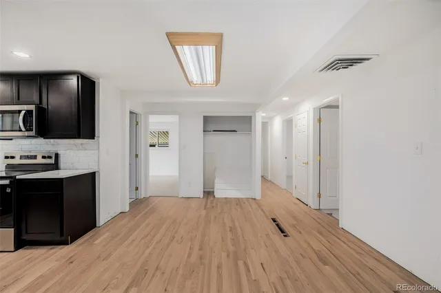a view of a kitchen from the hallway