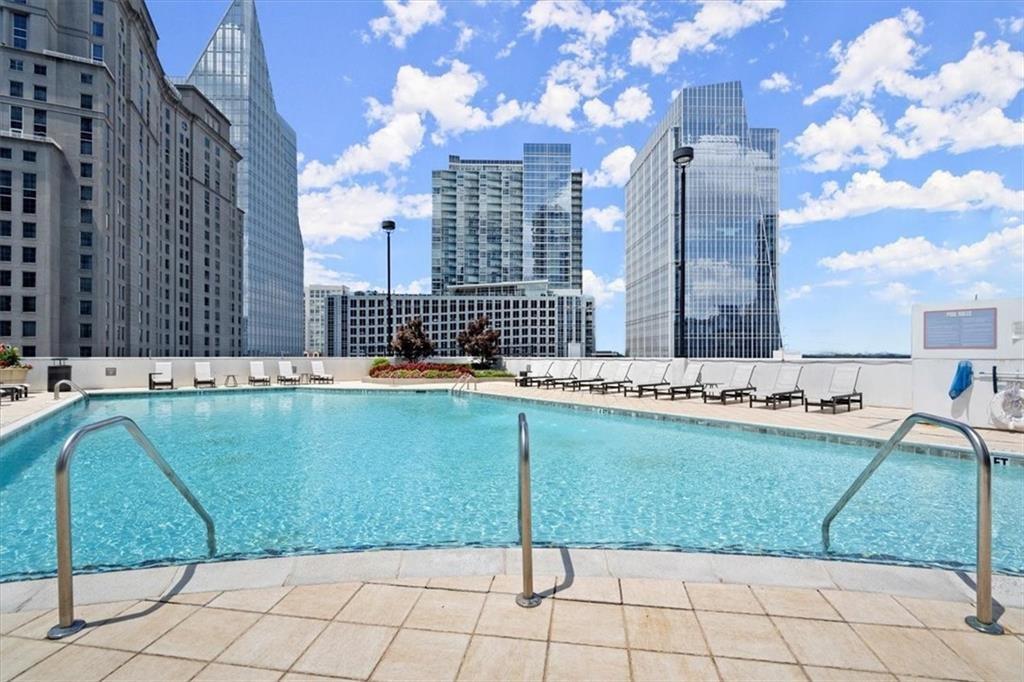 3324 Peachtree Road Northeast, Unit 2307 Atlanta, GA 30326 - Photo 20 of 42 a view of a swimming pool with a lounge chairs