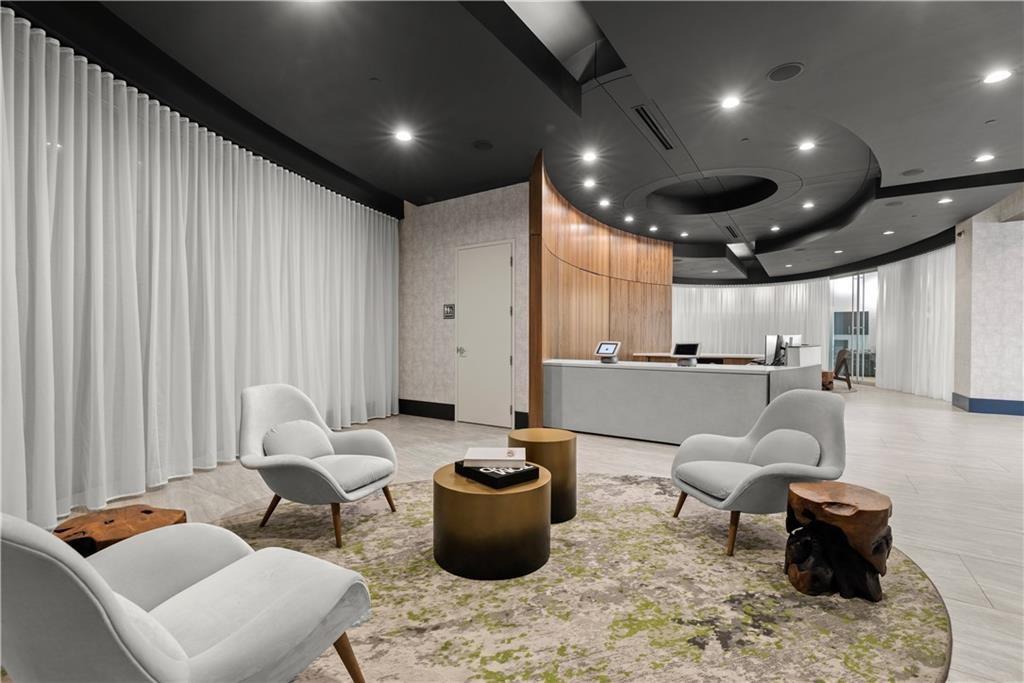 3324 Peachtree Road Northeast, Unit 2307 Atlanta, GA 30326 - Photo 24 of 42 a living room with furniture and a view of kitchen