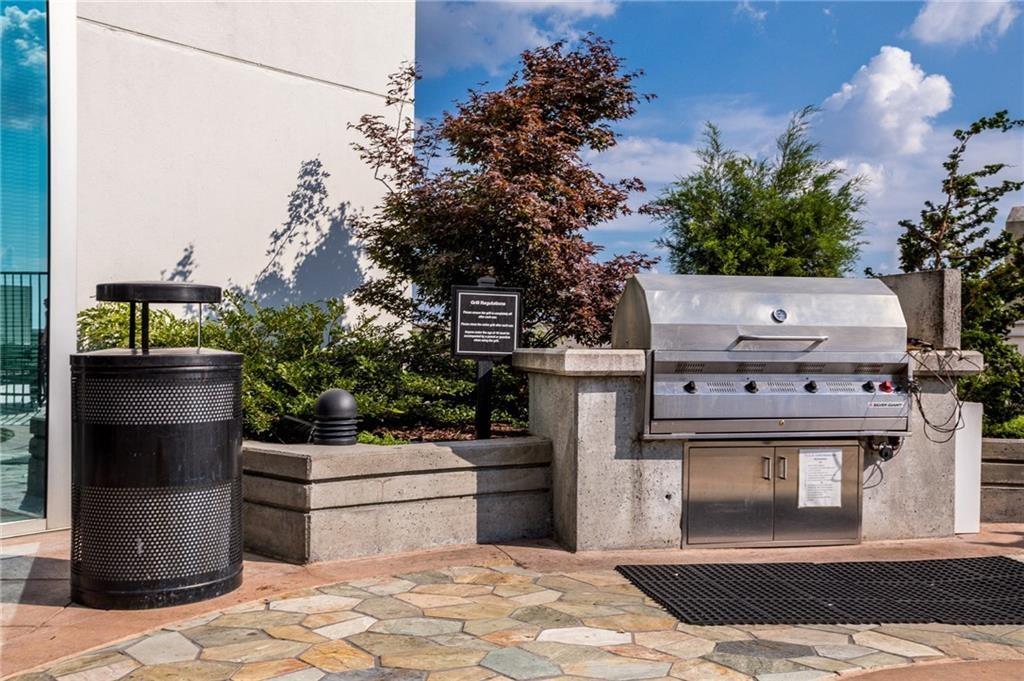 3324 Peachtree Road Northeast, Unit 2307 Atlanta, GA 30326 - Photo 38 of 42 a view of a kitchen with a stove and a refrigerator