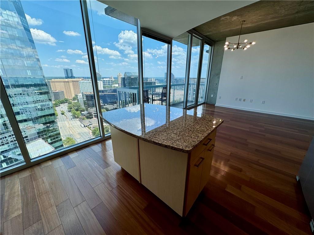 3324 Peachtree Road Northeast, Unit 2307 Atlanta, GA 30326 - Photo 7 of 42 wooden floor in an empty room with a window