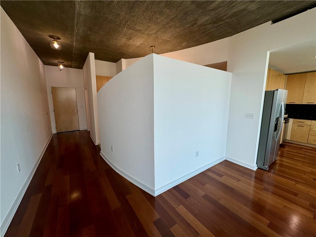 3324 Peachtree Road Northeast, Unit 2307 Atlanta, GA 30326 - Photo 10 of 42 a view of a hallway with wooden floor