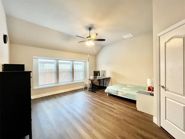a bathroom with a shower sink and mirror