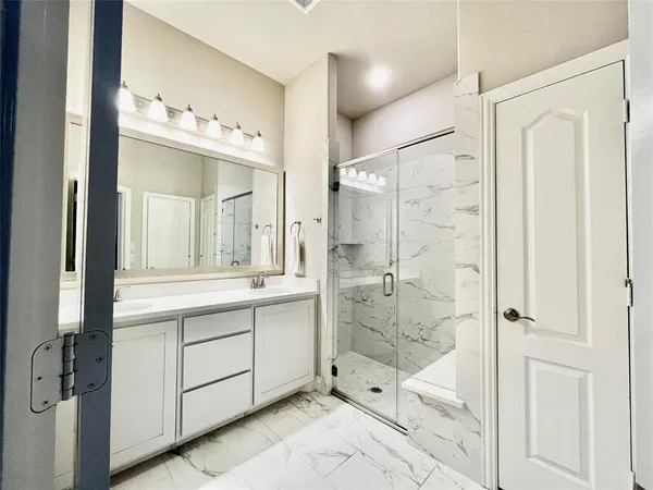 a bathroom with a shower and a toilet