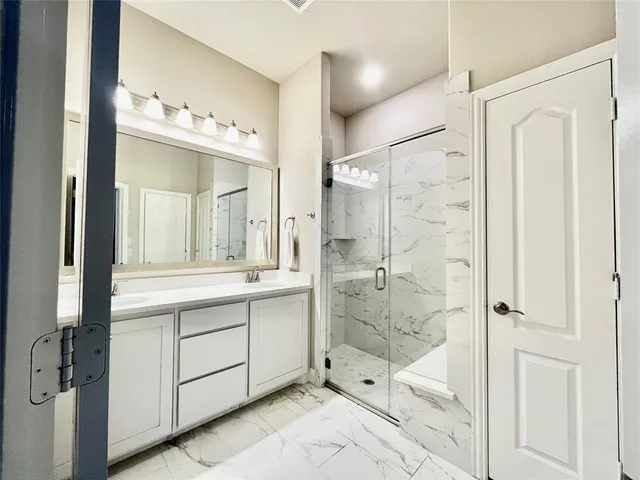 a bathroom with a shower and a toilet