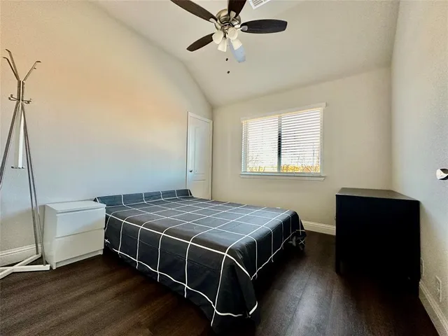 a bedroom with a bed and a table in it
