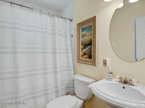 1910 Shadow Ridge Trail Jacksonville, FL 32225 - Photo 20 of 21 a bathroom with a sink and a mirror