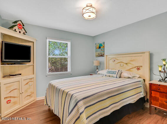 1910 Shadow Ridge Trail Jacksonville, FL 32225 - Photo 21 of 21 a bedroom with a bed and a flat screen tv
