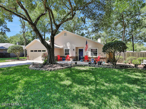 1910 Shadow Ridge Trail Jacksonville, FL 32225 - Photo 4 of 21 a front view of house with yard and outdoor seating