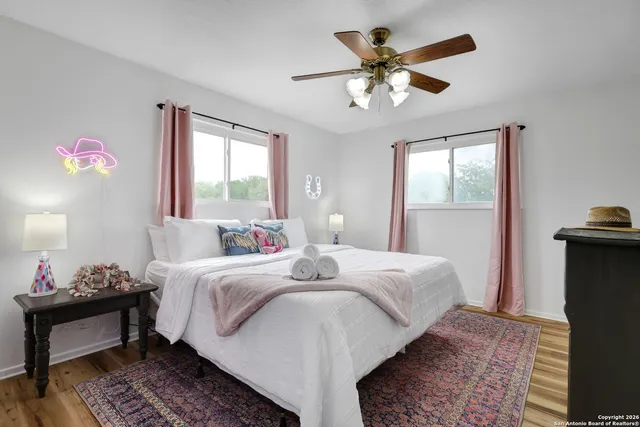 a bed room with a bed and a chandelier