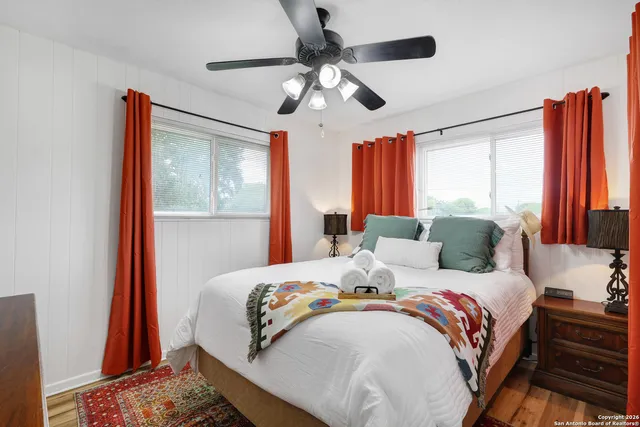 a bedroom with bed and window