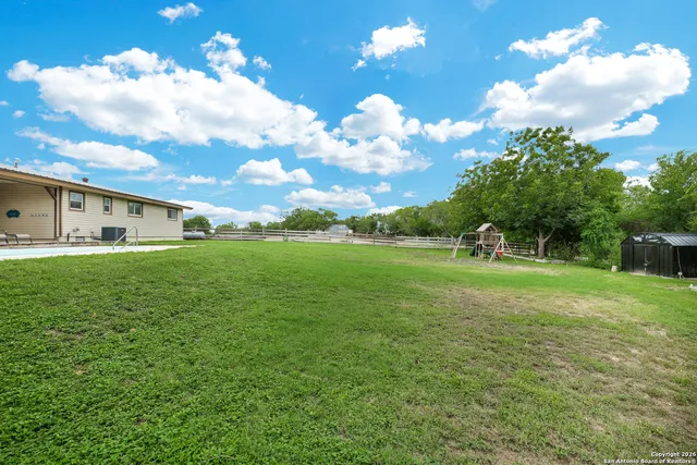 a view of a house with a big yard