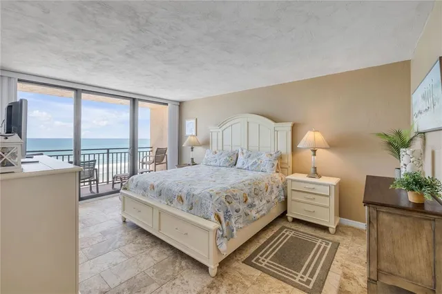 a bed room with a bed and a large window