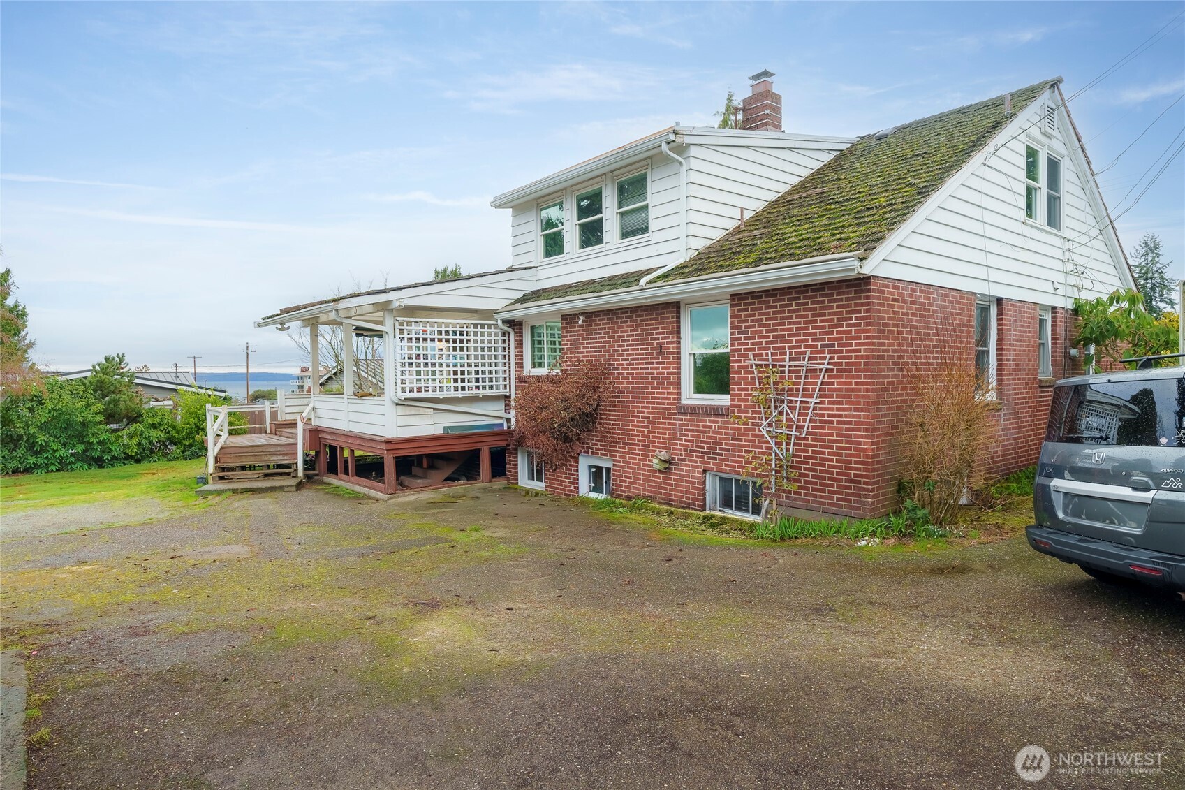 1020 Puget Drive Edmonds, WA 98020 - Photo 2 of 22 a view of a house with pool and chairs