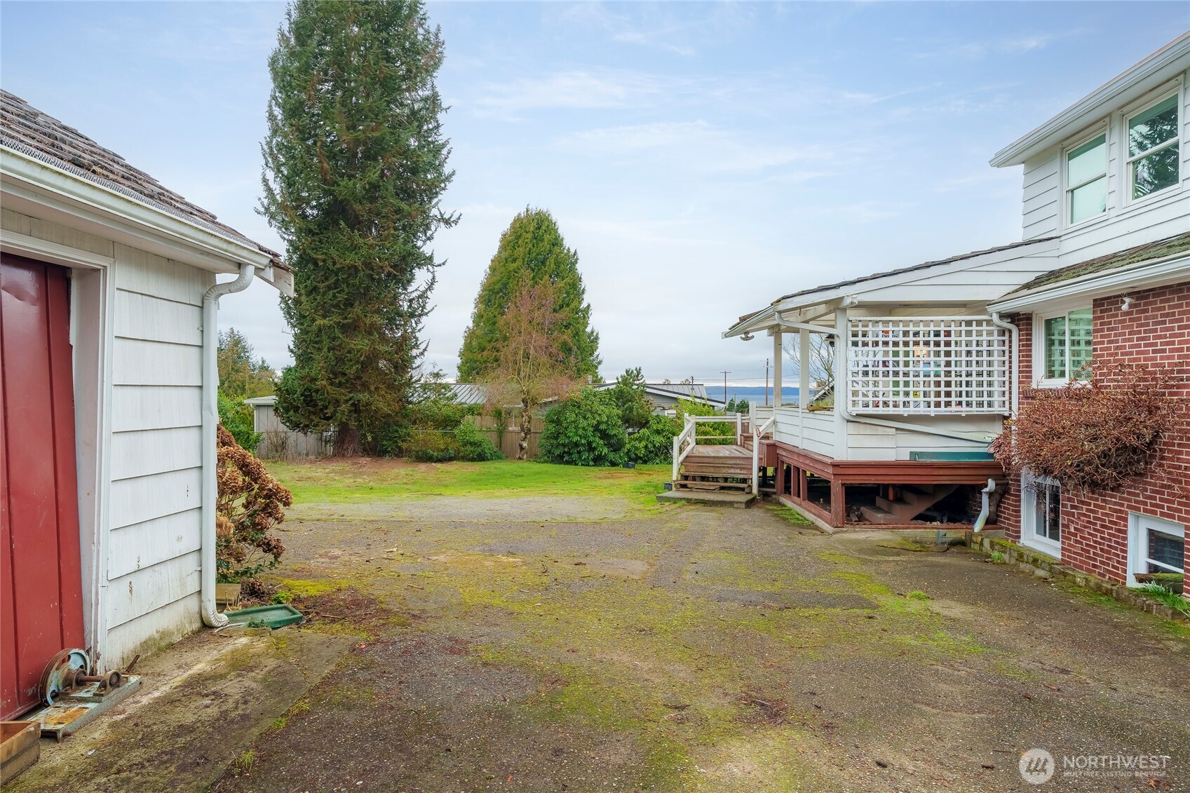 1020 Puget Drive Edmonds, WA 98020 - Photo 3 of 22 a view of a house with a yard and sitting area