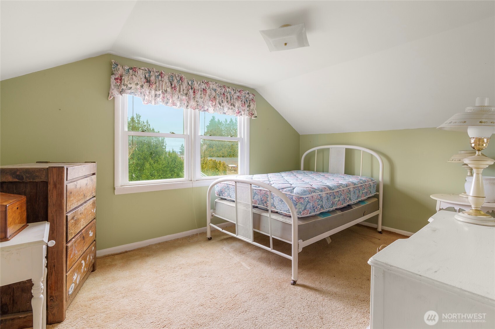 1020 Puget Drive Edmonds, WA 98020 - Photo 10 of 22 a bedroom with a bed and a table