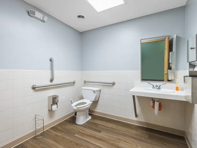 a bathroom with a glass shower door
