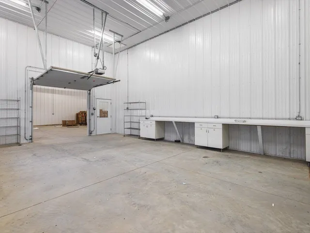 a bed room with furniture and a chandelier