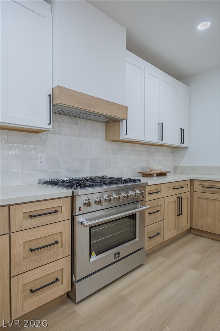 10982 Village Ridge Lane Las Vegas, NV 89135 - Photo 5 of 12 Culinary adventures await in this kitchen featuring abundant storage and a high-performance range.