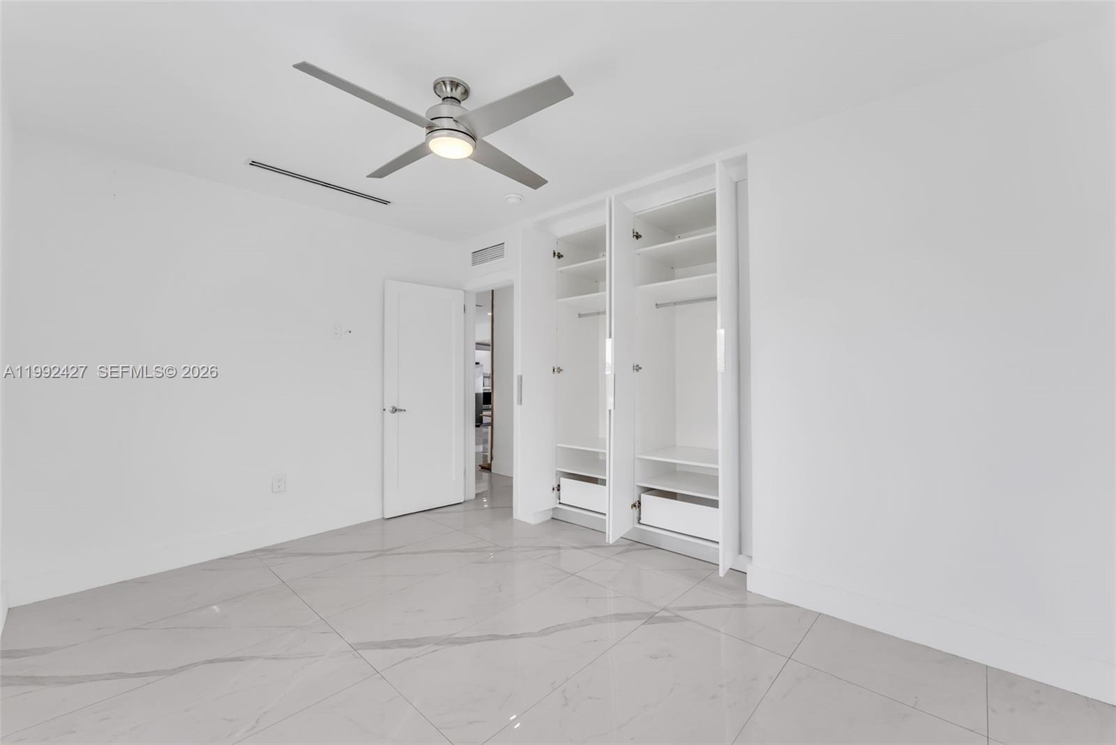 875 East 8th Street Hialeah, FL 33010 - Photo 14 of 36 a view of an empty room