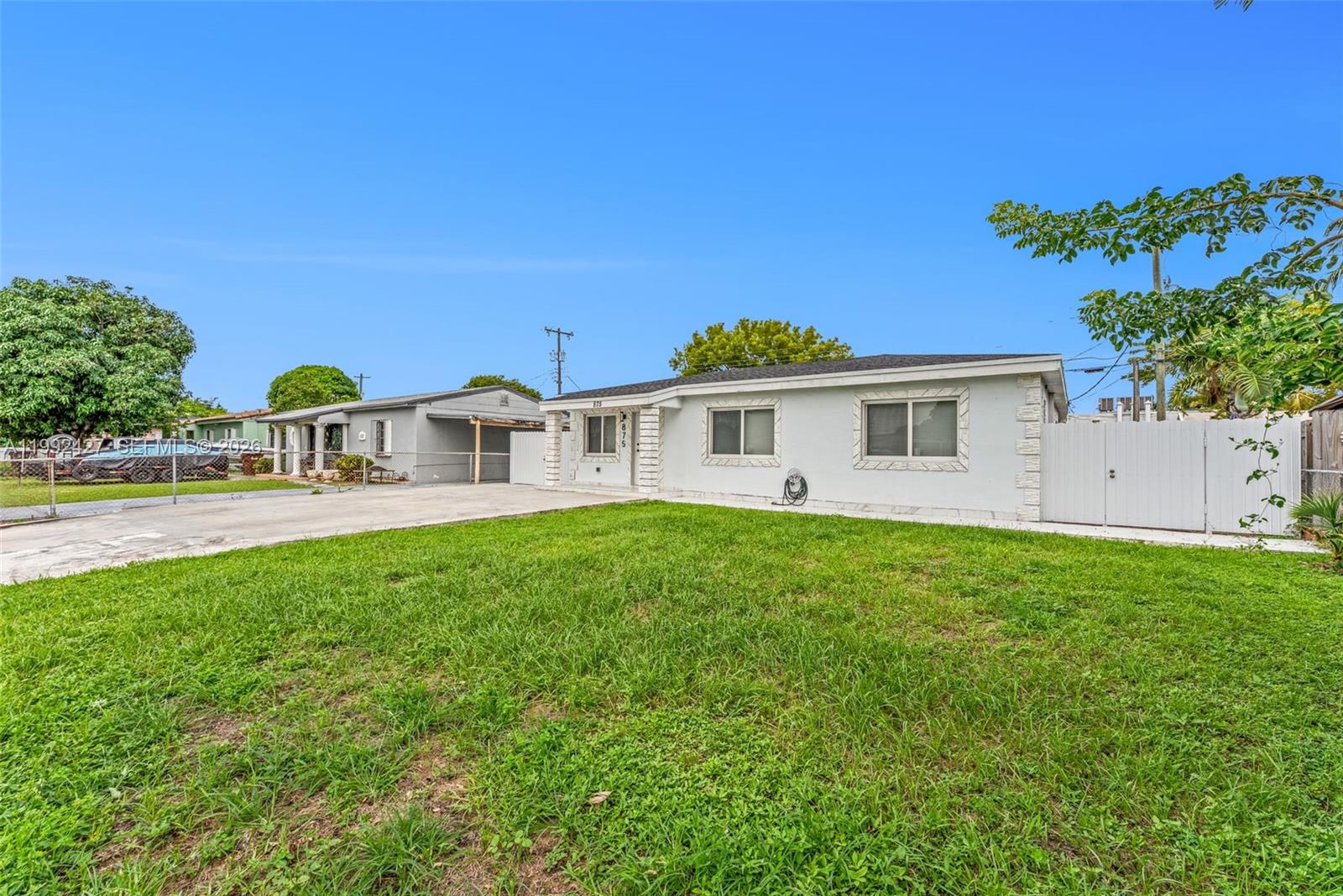875 East 8th Street Hialeah, FL 33010 - Photo 27 of 36 a front view of a house with garden