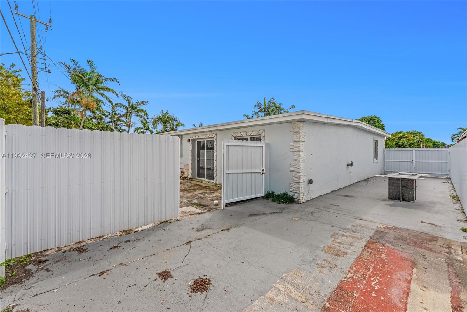 875 East 8th Street Hialeah, FL 33010 - Photo 30 of 36 a view of a house with a backyard