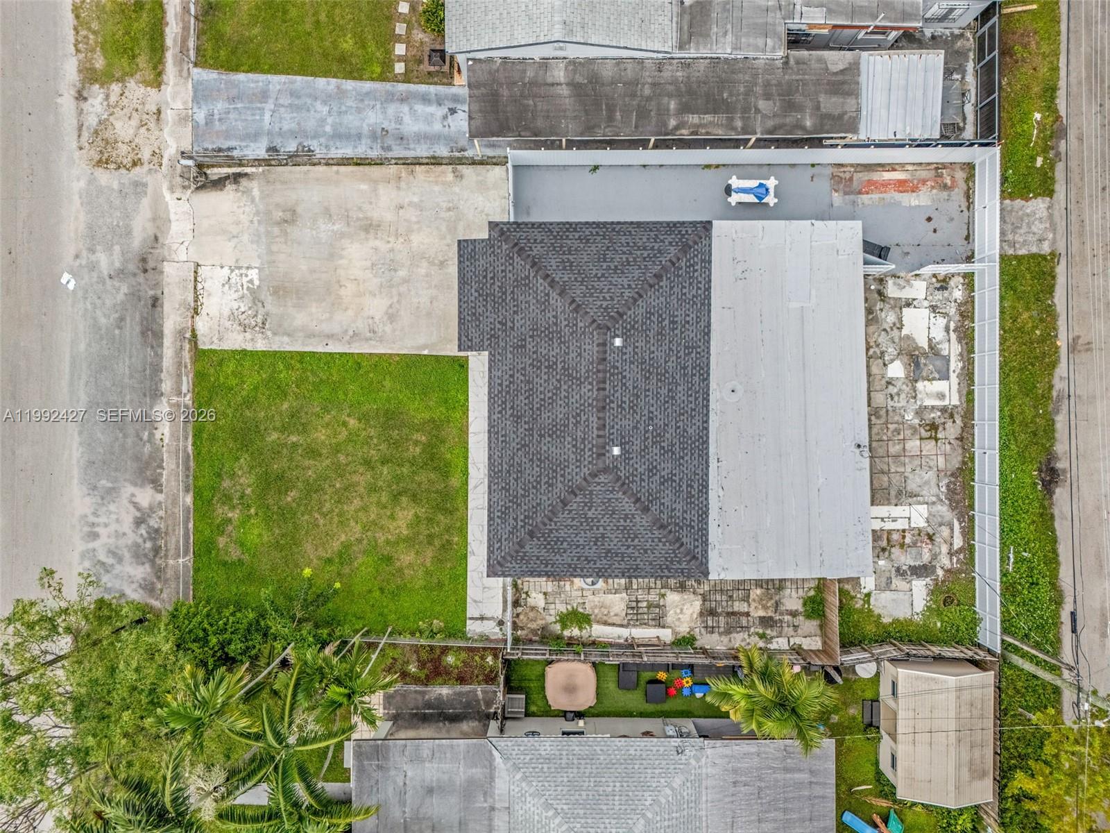 875 East 8th Street Hialeah, FL 33010 - Photo 31 of 36 a view of a brick wall of the house