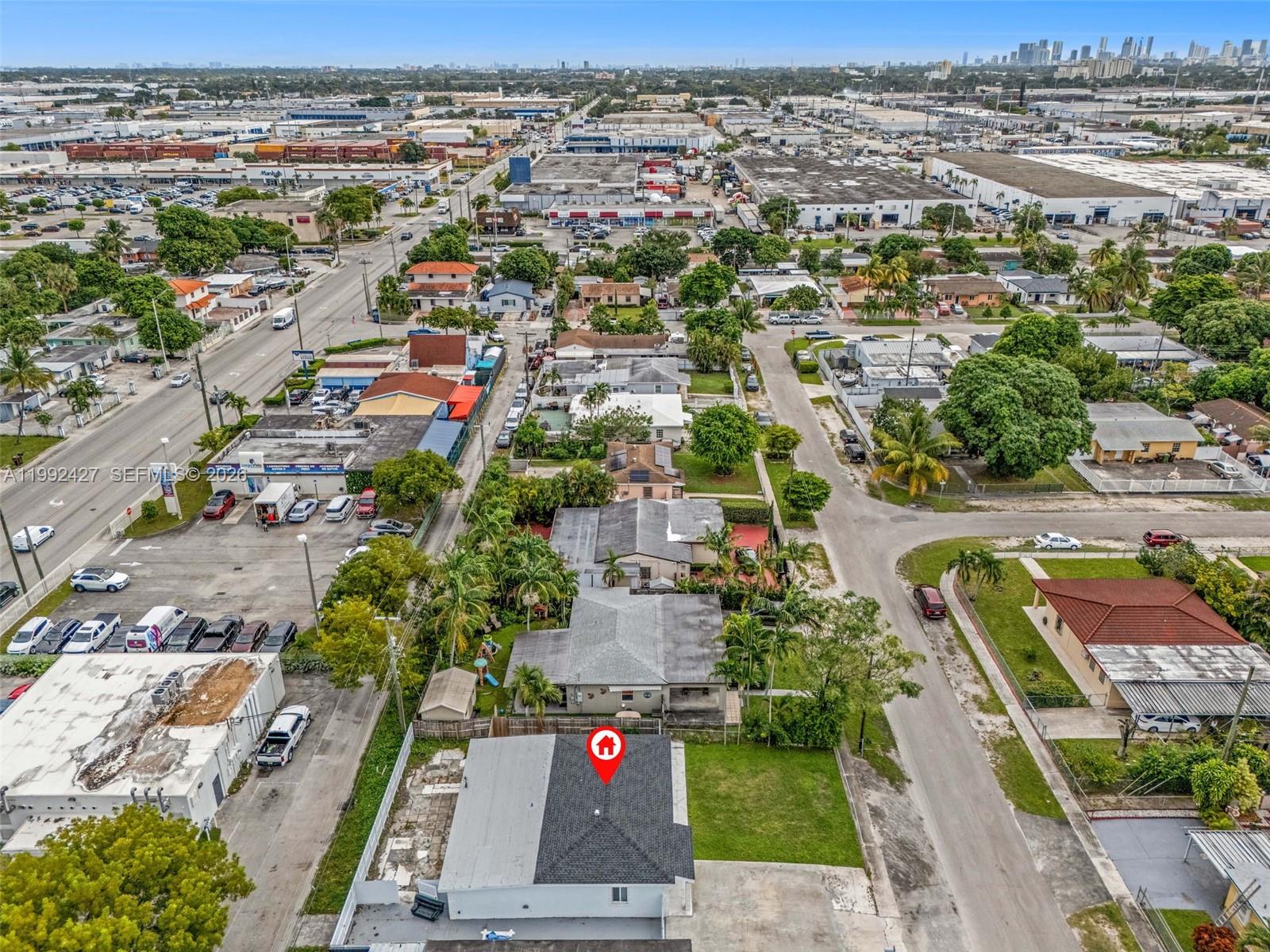 875 East 8th Street Hialeah, FL 33010 - Photo 35 of 36 an aerial view of residential houses with outdoor space and parking