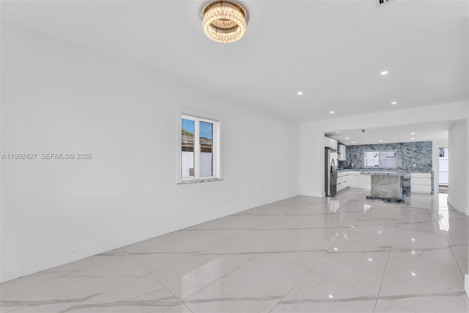 875 East 8th Street Hialeah, FL 33010 - Photo 9 of 36 a view of an empty room with a window