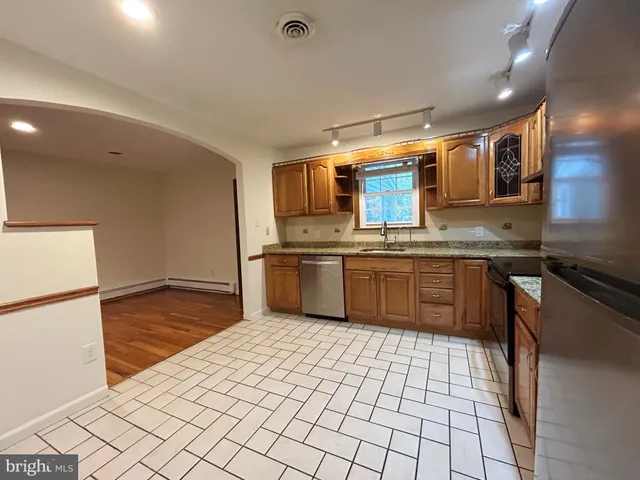 a view of kitchen with wooden floor