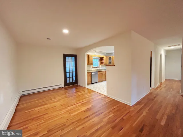 a view of a hallway with a hardwood floor