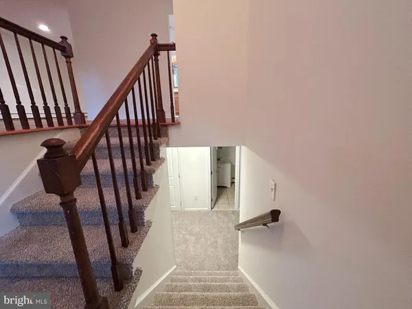 an empty room with a fireplace and a window