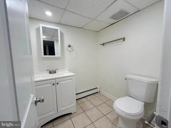 an empty room with a empty space and windows