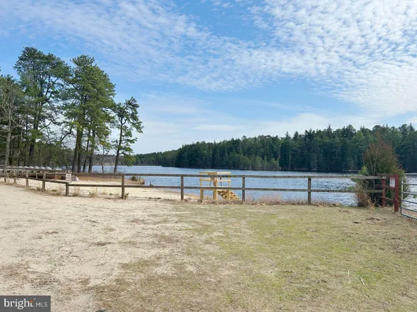 a view of a lake with a yard