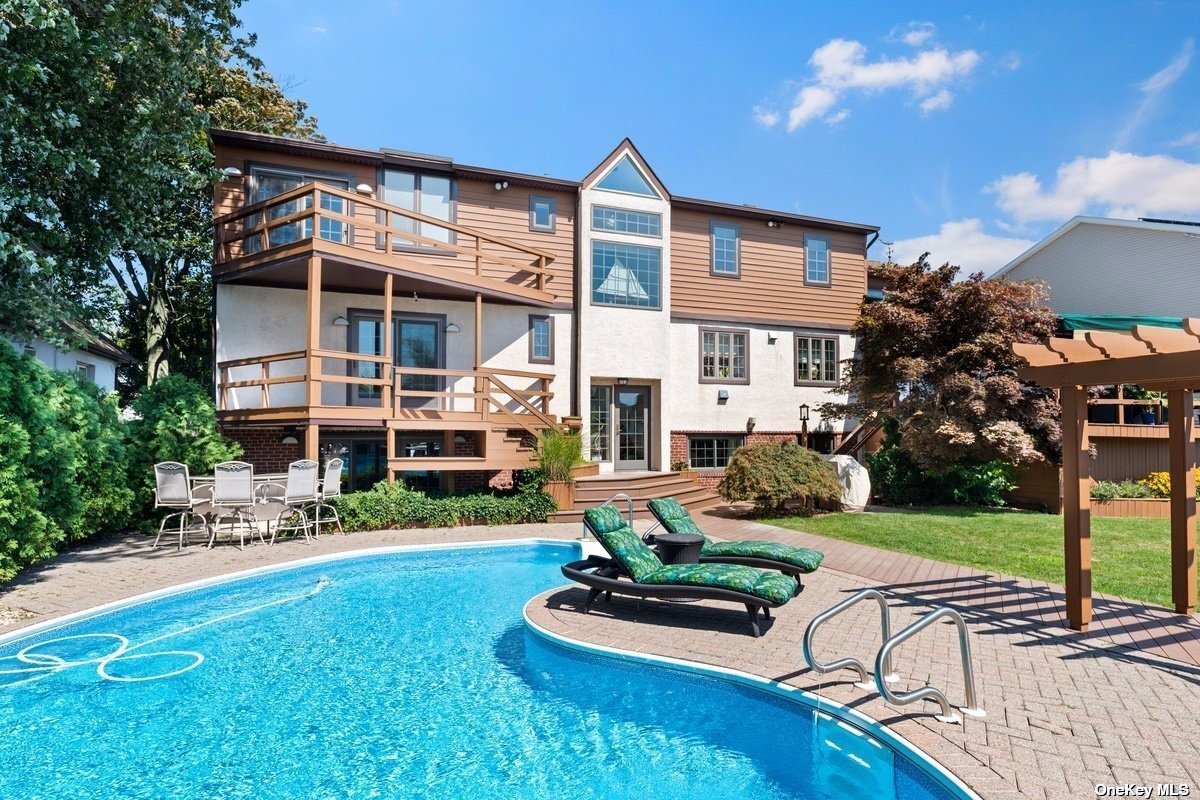a front view of house with yard and outdoor seating