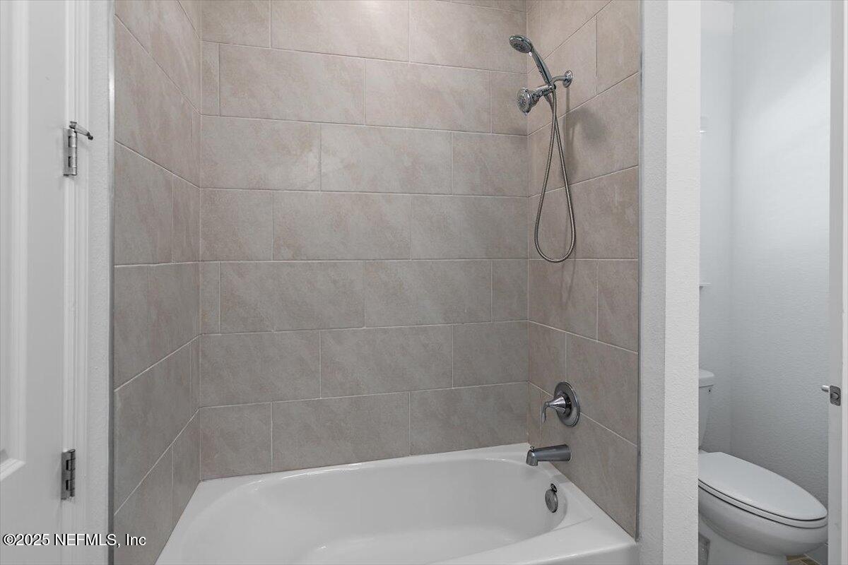 21 Pine Candle Way St. Augustine, FL 32092 - Photo 15 of 35 a bathroom with a shower and a toilet