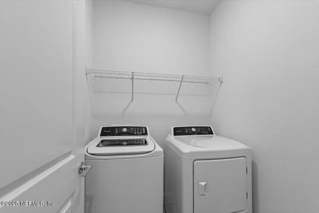 a utility room with dryer and washer