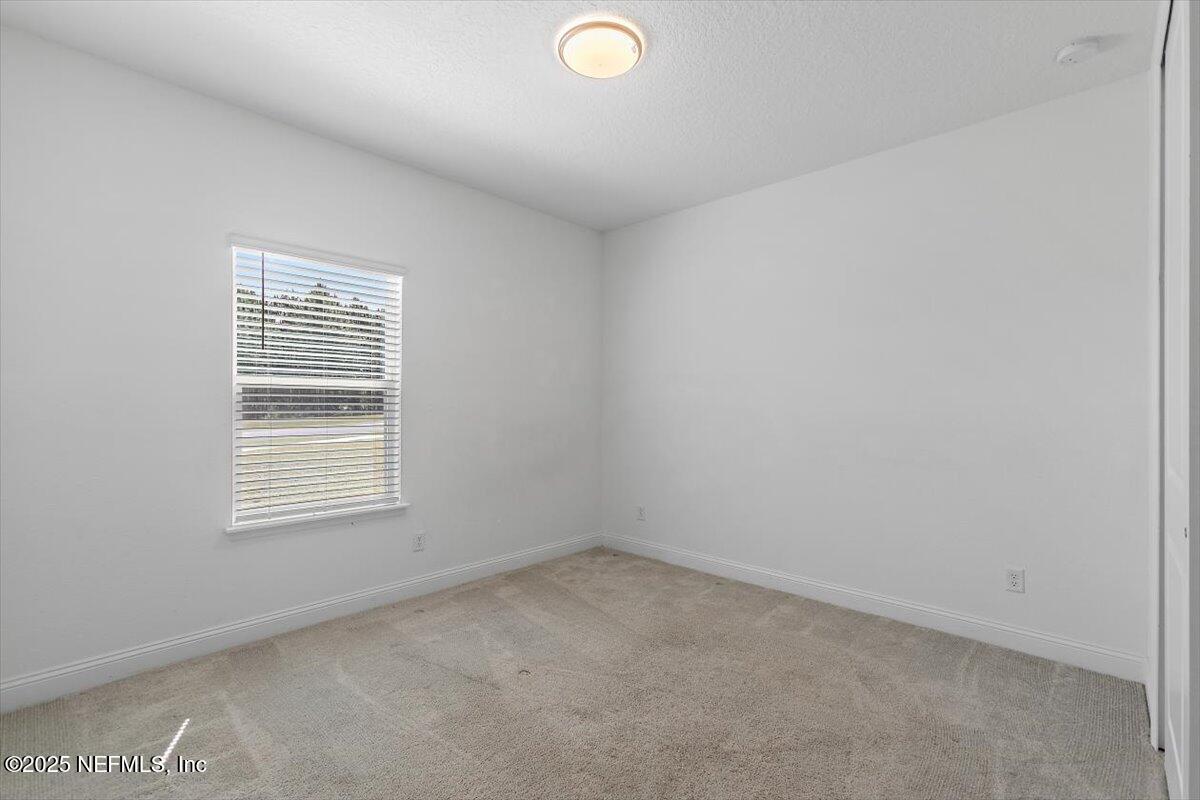 21 Pine Candle Way St. Augustine, FL 32092 - Photo 22 of 35 an empty room with a window