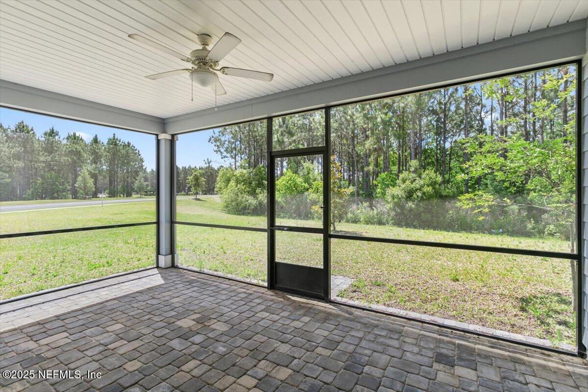 21 Pine Candle Way St. Augustine, FL 32092 - Photo 25 of 35 wooden floor in an empty room with a large window