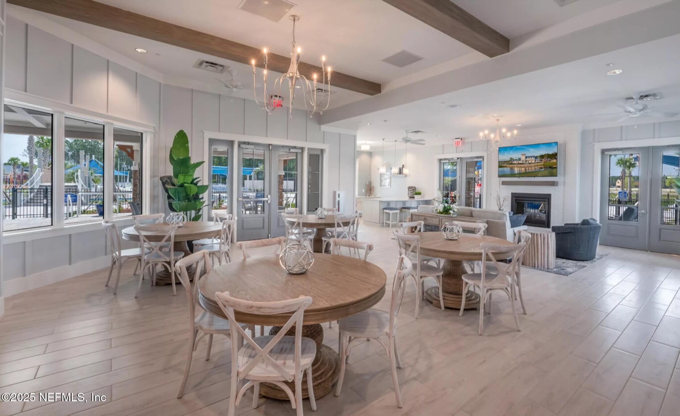 21 Pine Candle Way St. Augustine, FL 32092 - Photo 32 of 35 a view of a dining room with furniture window and wooden floor